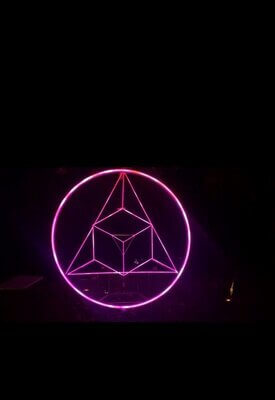 Image of Ricardo River's Sacred Sum. A glowing pink circle encloses a triangle which encloses a cube.